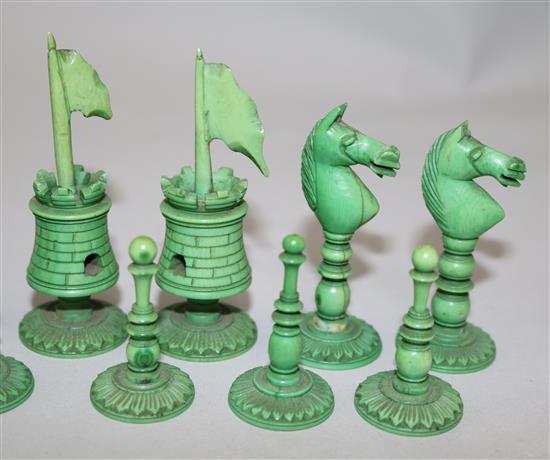 An early 19th century Anglo Indian green stained and plain ivory chess set, kings 4in.